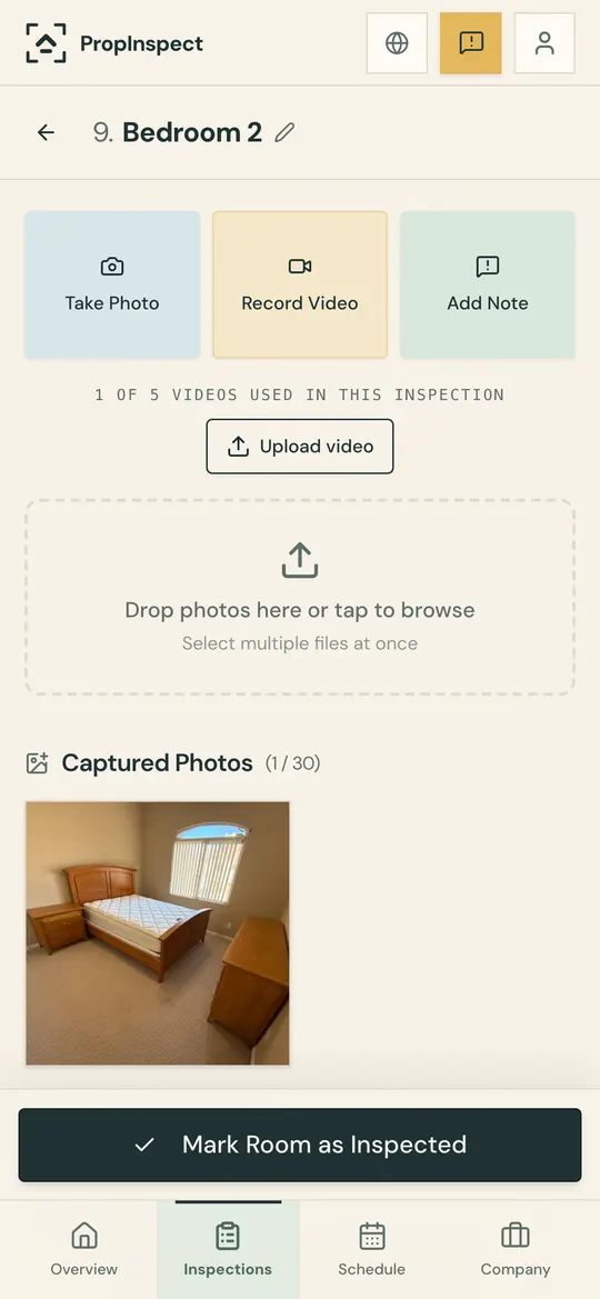 A bedroom in an inspection, with buttons to take a photo, record video or add a note