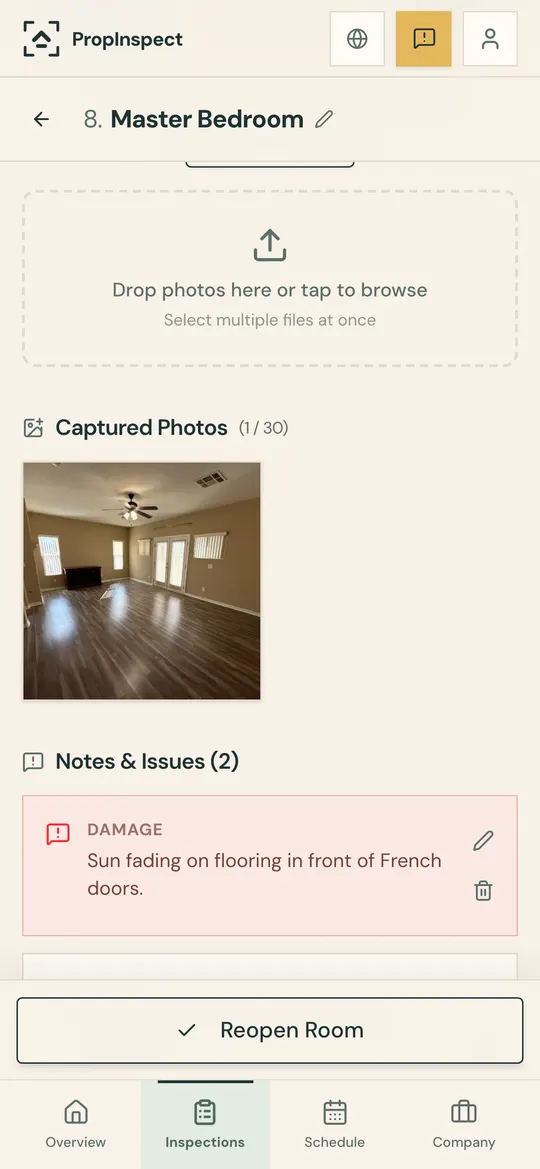 A room photo with a note tagged Damage below it